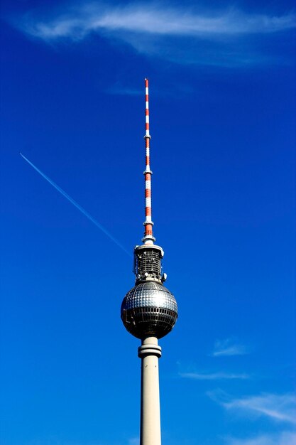 Low angle view of street light against blue sky