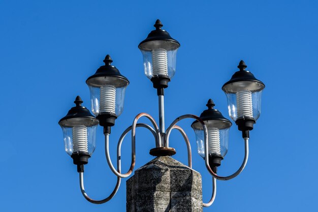 Low angle view of street light against building against sky