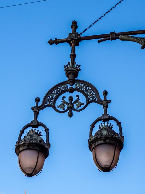 Low angle view of street light against clear blue sky