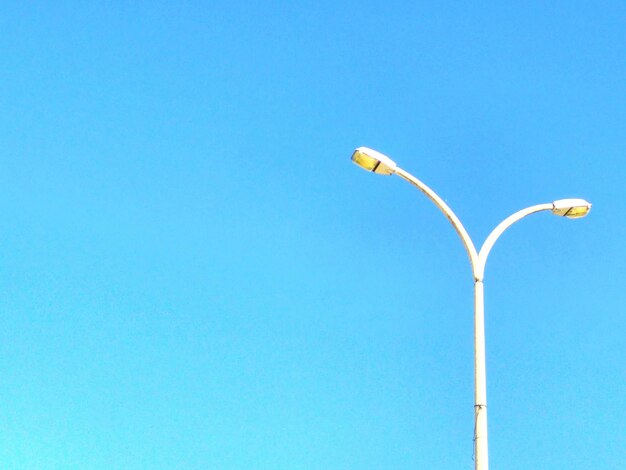 Low angle view of street light against clear sky