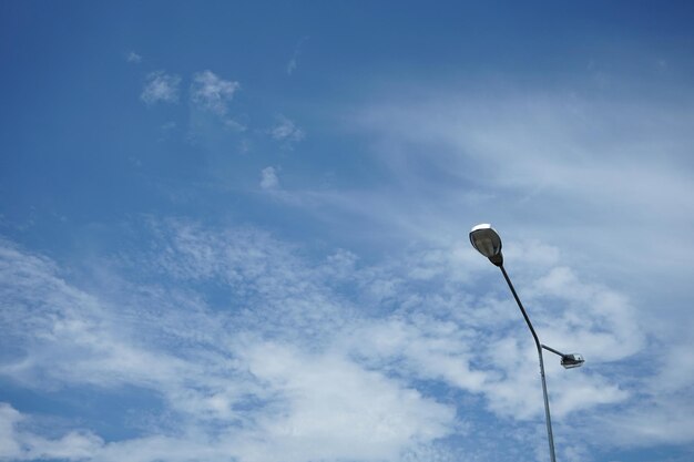 Low angle view of street light against sky