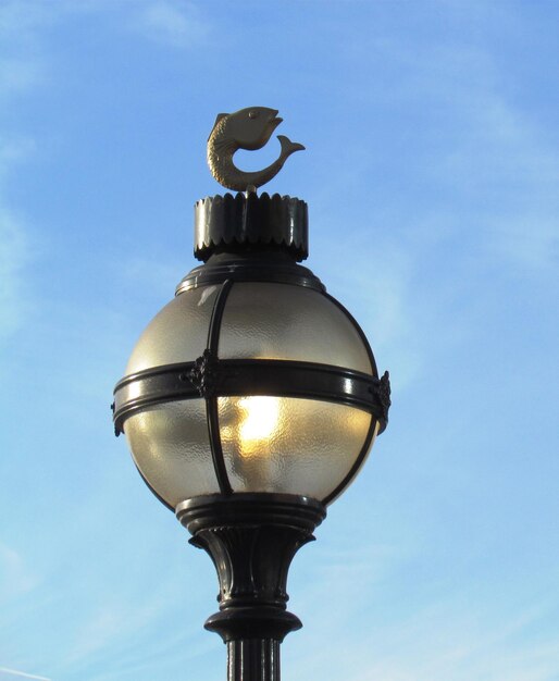 Low angle view of street light against sky