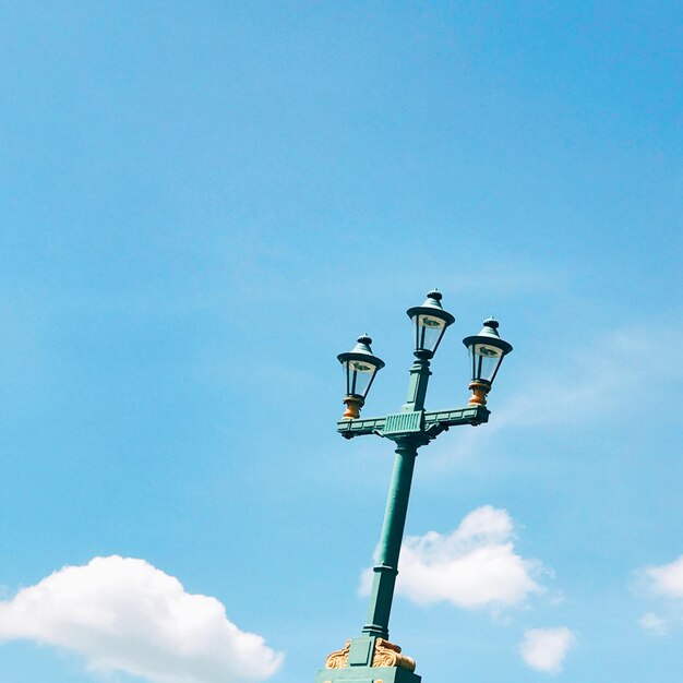 Low angle view of street light against sky