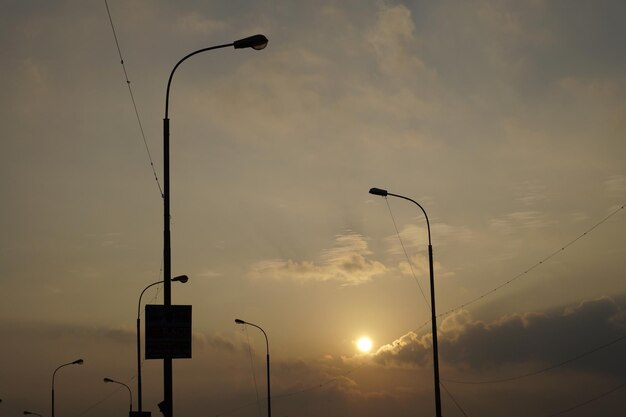 Low angle view of street light against sky