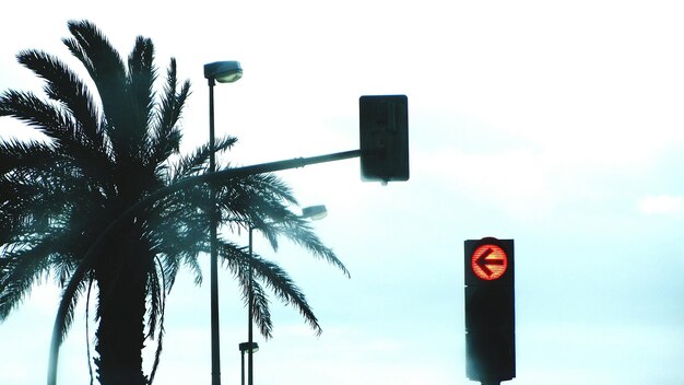 Low angle view of street light against sky