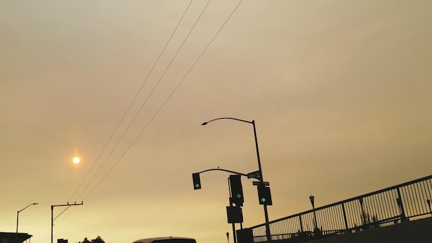 Low angle view of street light against sky