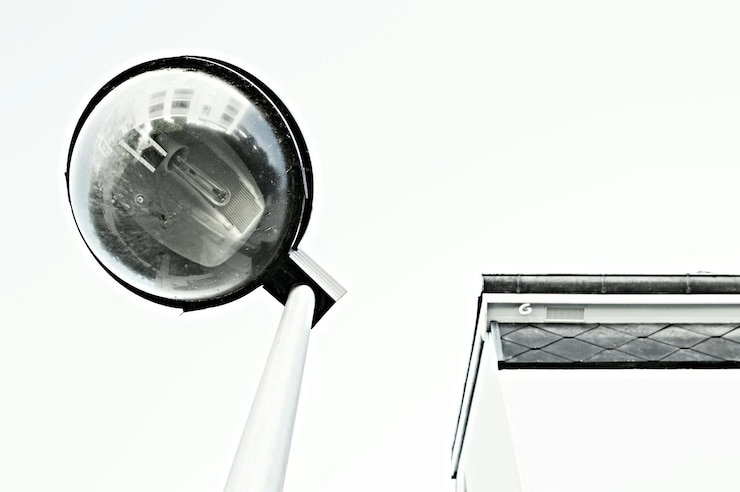 Photo low angle view of street light and building against sky