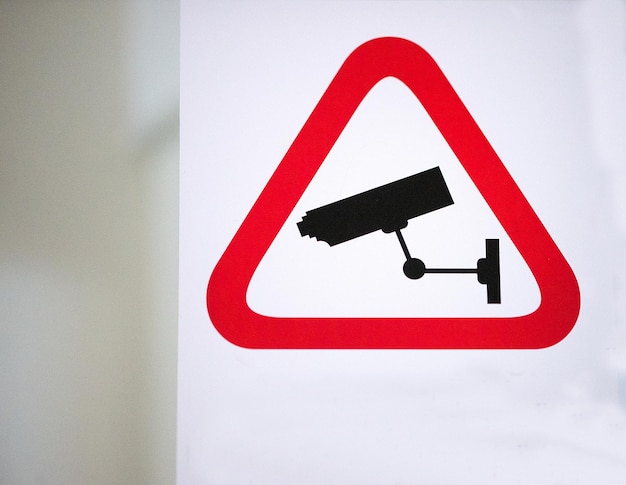 Low angle view of surveillance sign