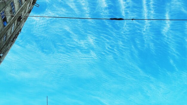 Low angle view of swimming pool against blue sky