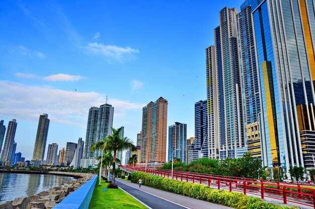 Low angle view of tall building against blue sky