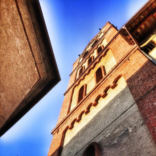 Low angle view of tall building against clear sky