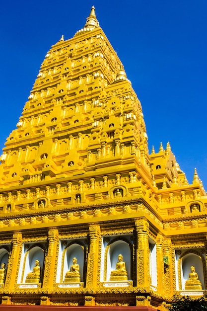 Low angle view of temple building against clear blue sky