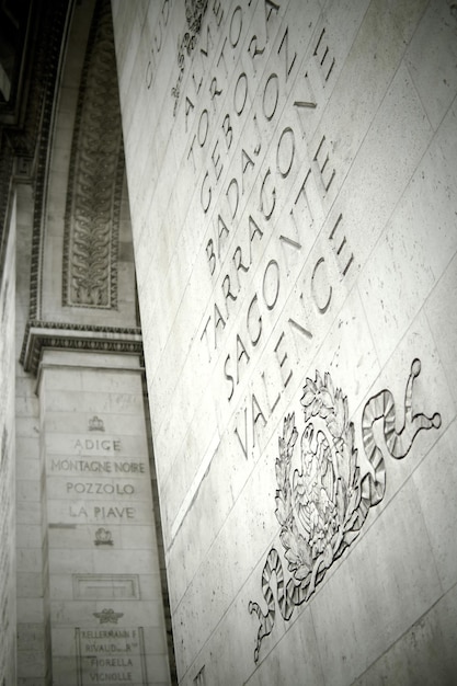 Low angle view of text engraved on arc de triomphe