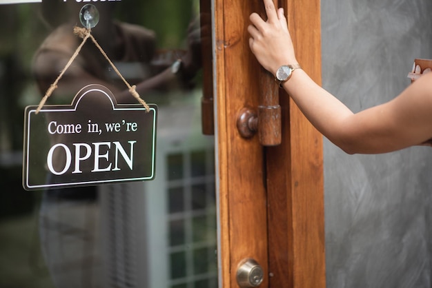 Low angle view of text on hand against door