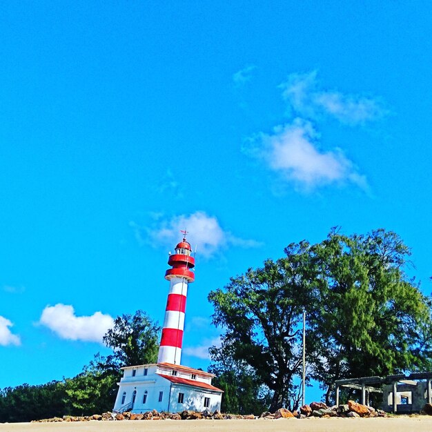 Low angle view of tower against blue sky