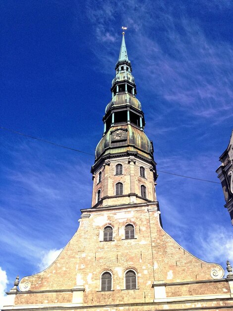 Low angle view of tower against blue sky