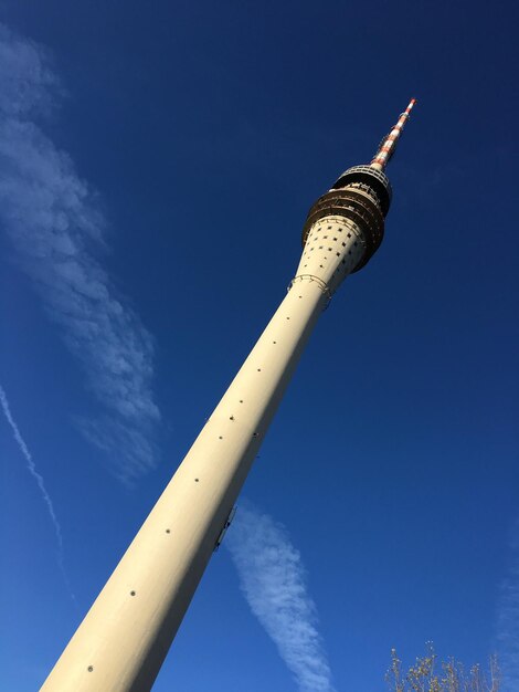 Low angle view of tower against blue sky