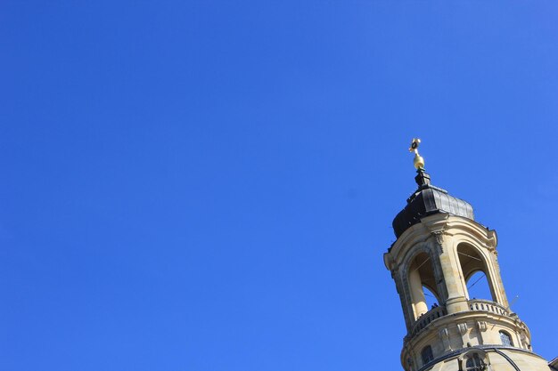 Low angle view of tower against clear blue sky