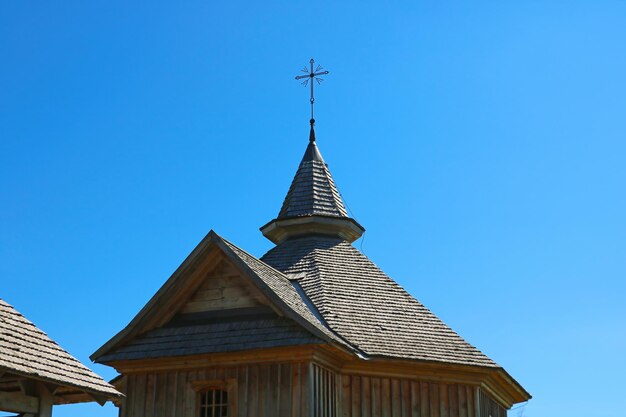 Low angle view of traditional building against clear blue sky