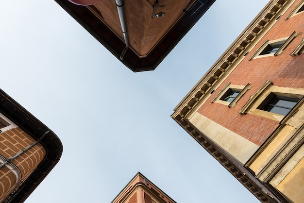 Low angle view of traditional buildings in the residential district of MalasaÃ±a in Madrid, Spain.