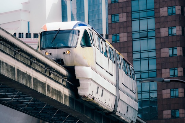 low angle view of train on bridge in city