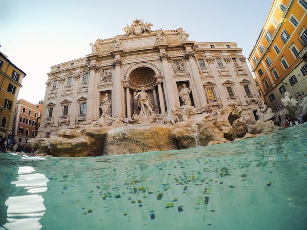 Low angle view of trevi fountain against sky