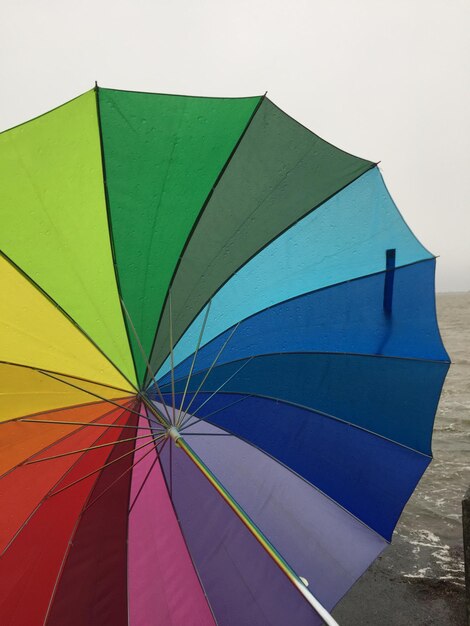 Low angle view of umbrella against sky