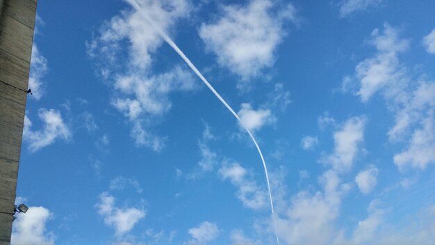 Low angle view of vapor trail against sky