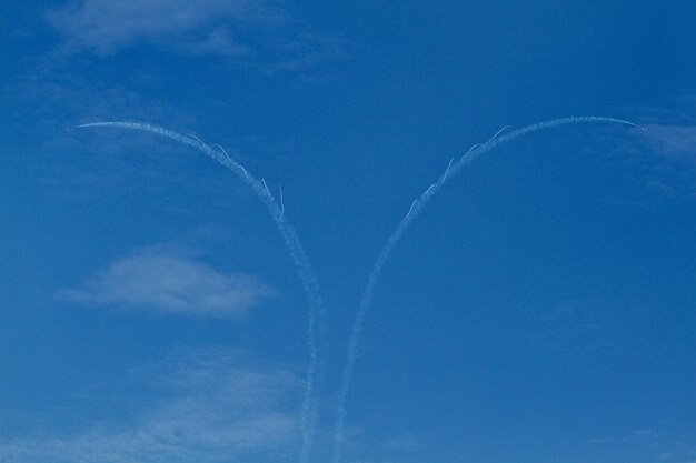 Low angle view of vapor trail in blue sky