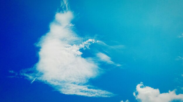 Low angle view of vapor trail in blue sky