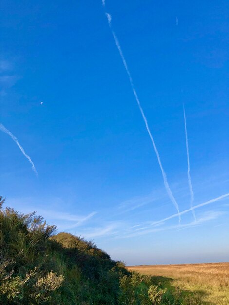 Low angle view of vapor trails in sky