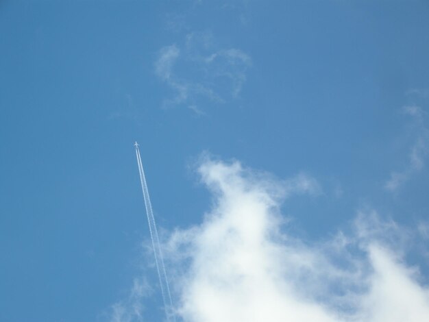 Low angle view of vapor trails in sky