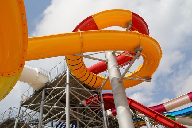 Photo low angle view of water slide against cloudy sky