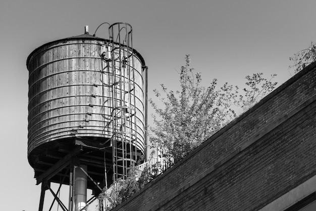 Low angle view of water tower against clear sky