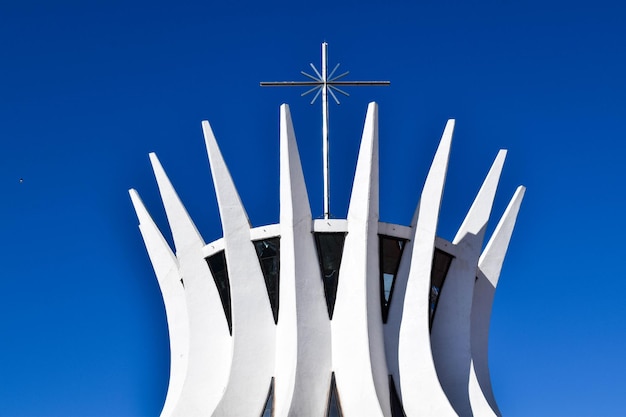 Low angle view of white flag against blue sky