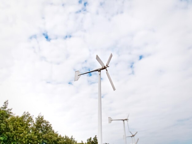 Low angle view of wind turbine against sky