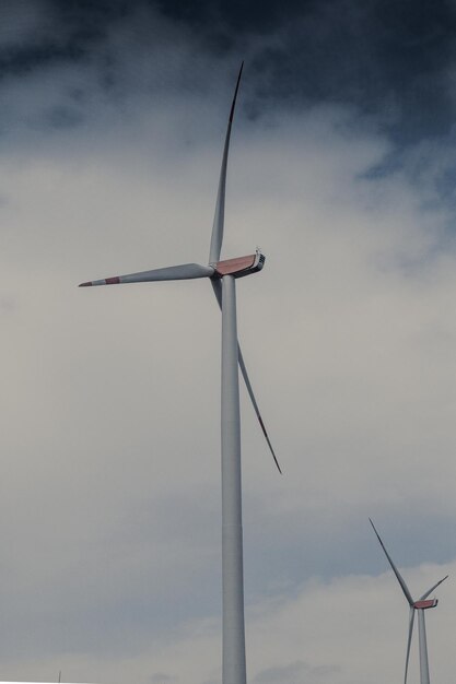 Low angle view of wind turbine against sky