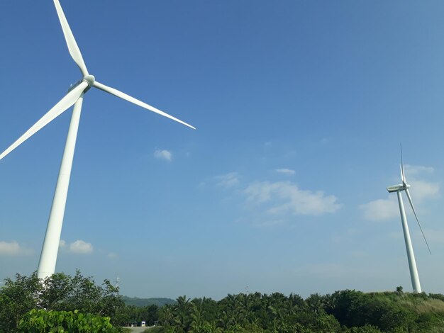 Low angle view of windmill against sky