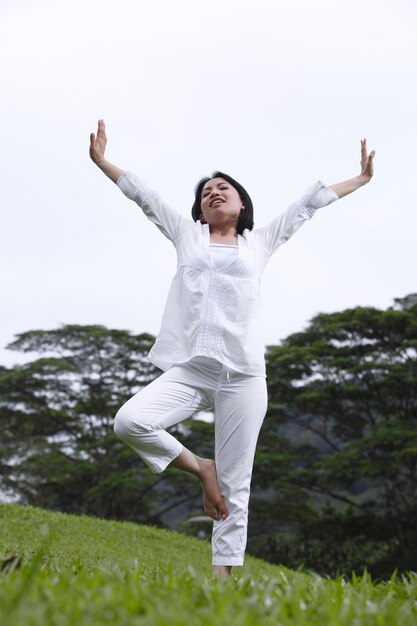 Low angle view of woman against clear sky