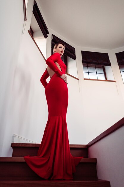 Low angle view of woman red wearing gown on steps