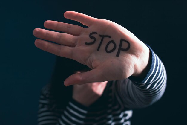 Photo low angle view of woman with text against black background