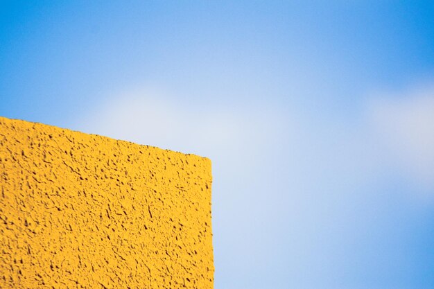 Low angle view of yellow blue sky
