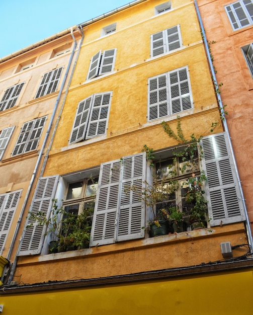 Low angle view of yellow building against sky