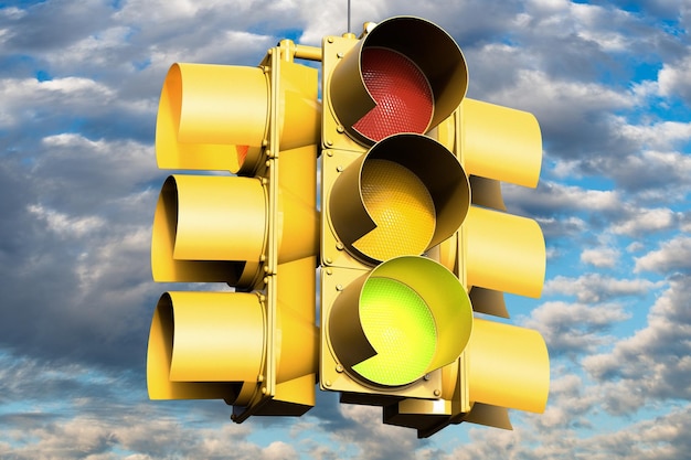 Low angle view of yellow traffic signal against sky