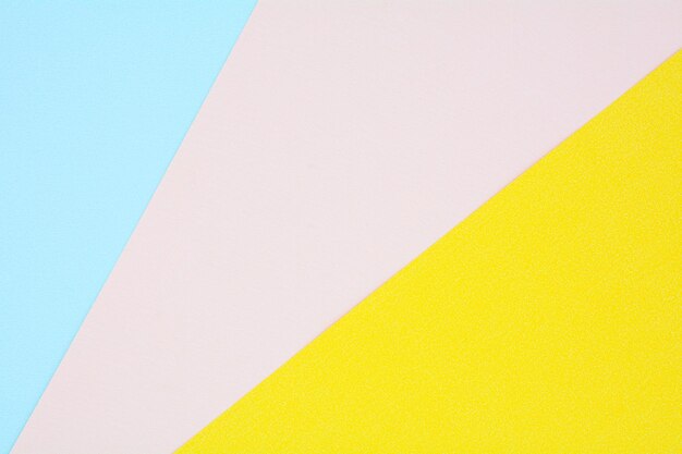 Low angle view of yellow wall against clear blue sky