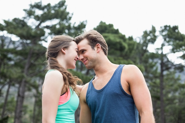 Low angle view of young couple couple at forest