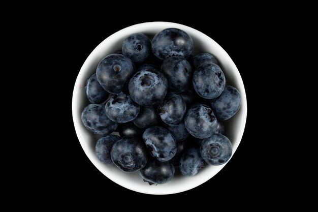 Low blue berry in a white bowl Top view