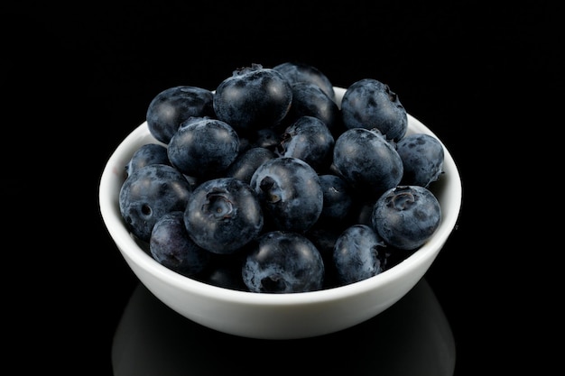 Low blue berry in a white bowl