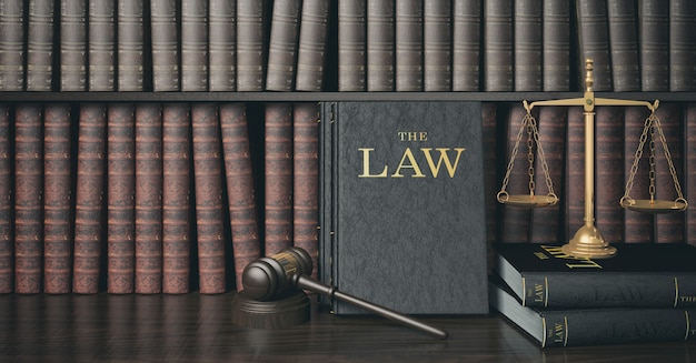 Photo low key filter law bookshelf with wooden judge's gavel and golden scale