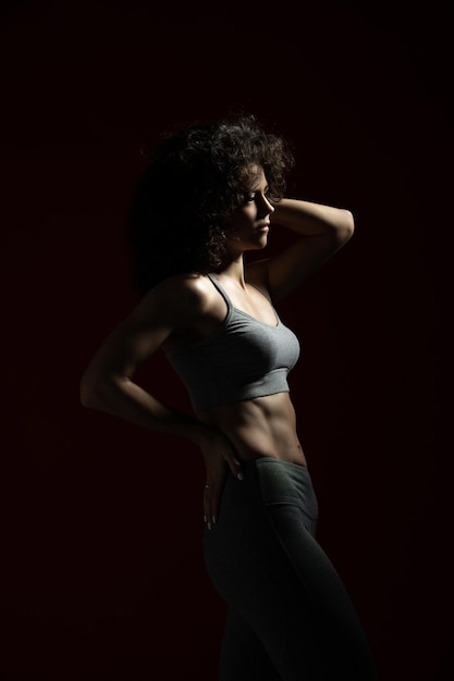 Low key silhouette of a fitness young woman